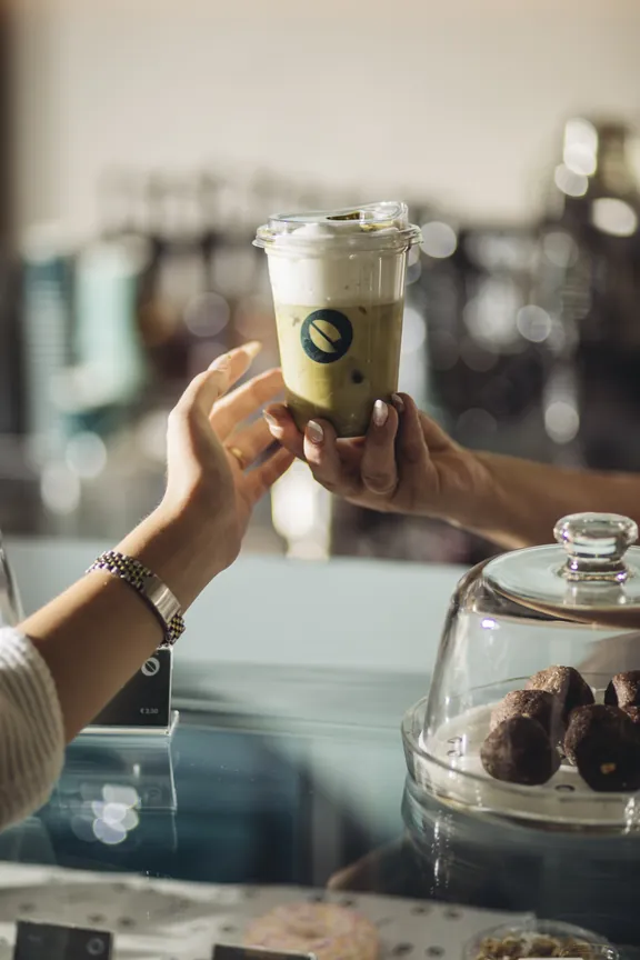 Friends toasting with iced Kawacom's coffees